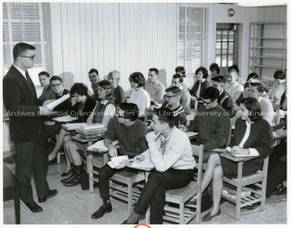 English Professor John Grube teaching a literature class in what used to be a barn at the back of Beaverbrook House, 1964. UA PC 9e; Item no. 2 (44)