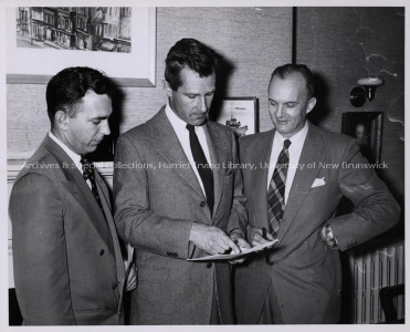 A. H. Kingett and Colin B. Mackay looking at plans to move teacher's college to UNB with Dr. Love