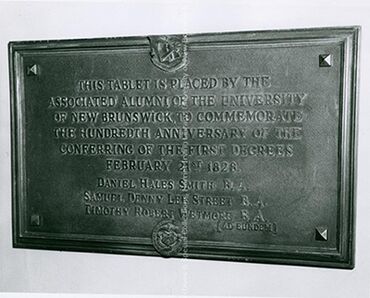 Plaque to commemorate the 100th anniversary of the conferring of the first degrees at UNB, 1967. PR; Series 2; Sub-series 3; File 721; Item 19, 7 December 1967.